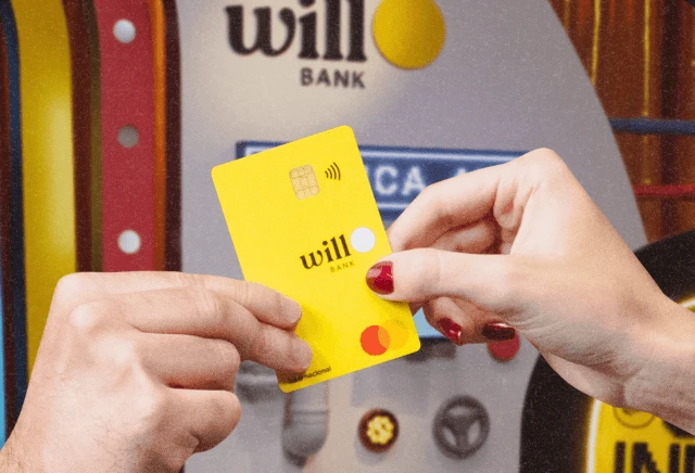 Logotipo do Will Bank em destaque sobre fundo amarelo, ilustrando o contexto de liquidação extrajudicial da instituição.