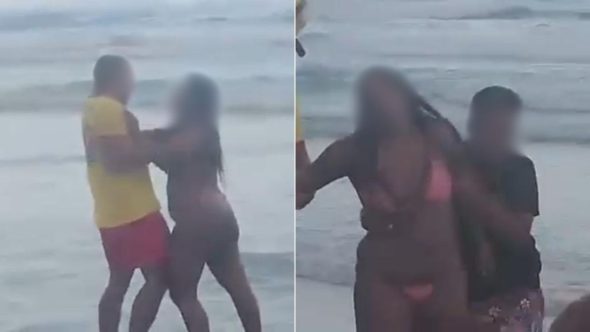Guarda-vidas agredido por banhistas na Praia da Enseada em Guarujá, litoral de São Paulo, durante ocorrência.